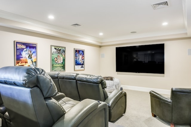 carpeted home theater room with ornamental molding