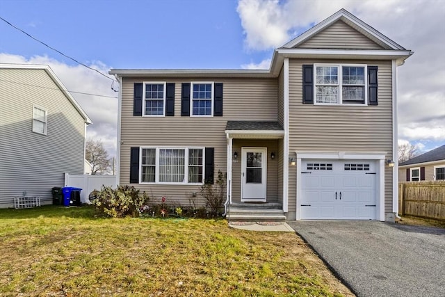 front of property with a garage and a front lawn