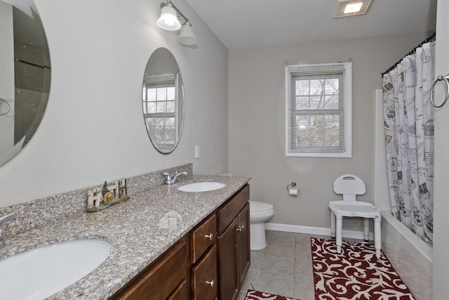 full bathroom with tile patterned flooring, vanity, plenty of natural light, and toilet