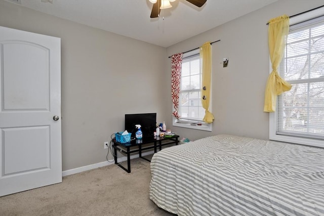 bedroom featuring light carpet and ceiling fan