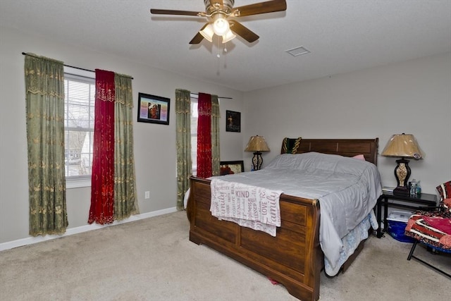 bedroom featuring ceiling fan and light carpet