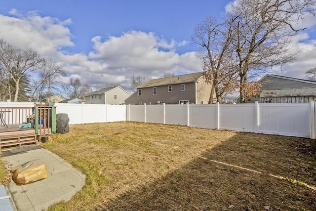 view of yard featuring a wooden deck