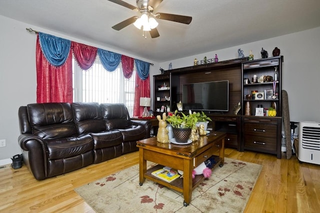 living room featuring hardwood / wood-style flooring and ceiling fan