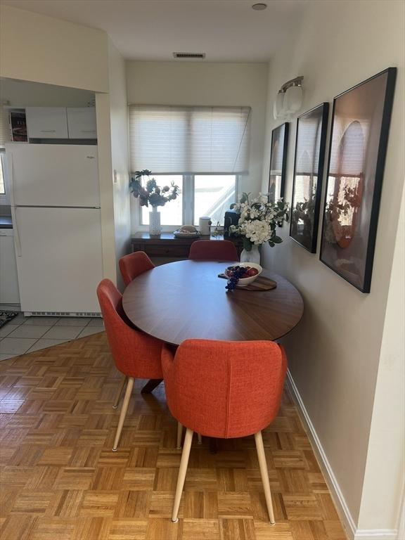 121 Longwood Ave Unit 4B, Brookline, MA 02446 - dining area featuring baseboards