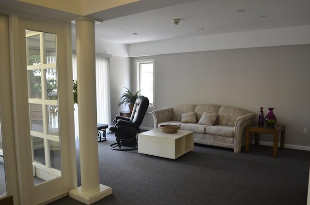 121 Longwood Ave Unit 4B, Brookline, MA 02446 - living room with decorative columns and dark colored carpet