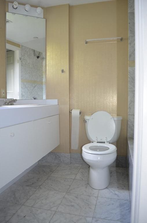 121 Longwood Ave Unit 4B, Brookline, MA 02446 - bathroom featuring vanity, marble finish flooring, and a shower