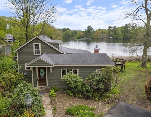 38 Lakeshore Dr, Wayland, MA 01778 - view of front of home featuring a water view, a chimney, a dock, and roof with shingles