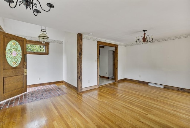 38 Lakeshore Dr, Wayland, MA 01778 - foyer with a chandelier, light wood-type flooring, and baseboards