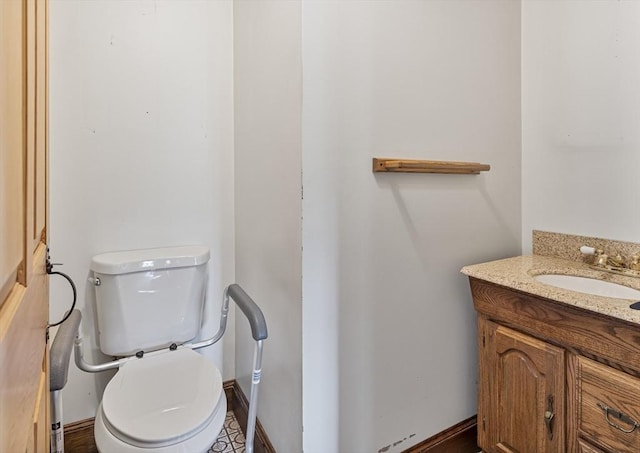38 Lakeshore Dr, Wayland, MA 01778 - half bathroom with toilet, vanity, and baseboards