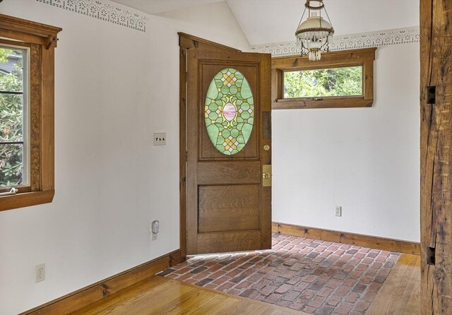 38 Lakeshore Dr, Wayland, MA 01778 - foyer featuring baseboards, healthy amount of natural light, lofted ceiling, and brick flooring