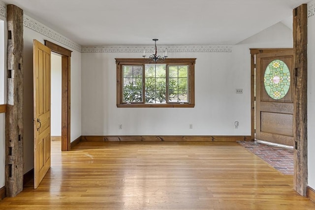 38 Lakeshore Dr, Wayland, MA 01778 - entryway with light wood-style floors, a chandelier, and baseboards