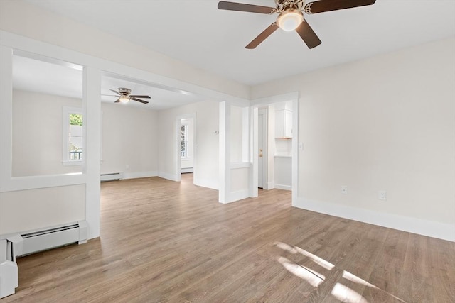 59 Altamont St, Haverhill, MA 01830 - spare room with a ceiling fan, light wood finished floors, baseboards, and a baseboard heating unit