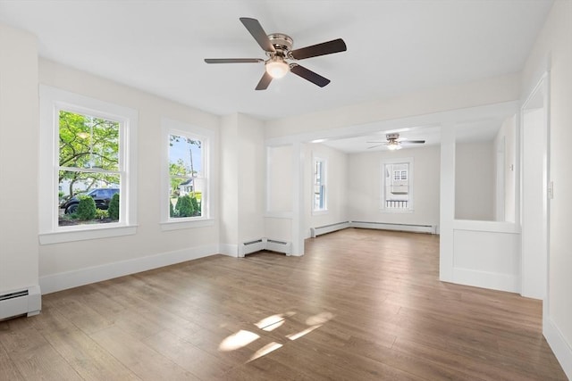 59 Altamont St, Haverhill, MA 01830 - unfurnished room featuring healthy amount of natural light, a baseboard heating unit, and wood finished floors