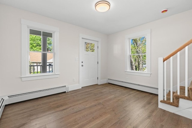 59 Altamont St, Haverhill, MA 01830 - foyer featuring baseboard heating, plenty of natural light, wood finished floors, and stairway