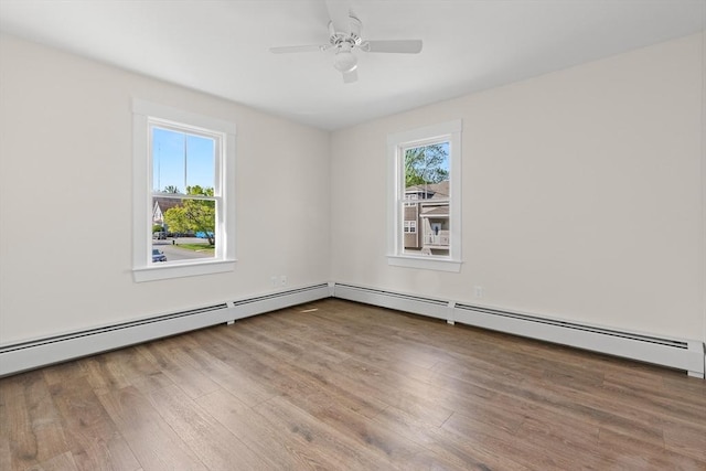 59 Altamont St, Haverhill, MA 01830 - empty room featuring wood finished floors, ceiling fan, and a baseboard heating unit