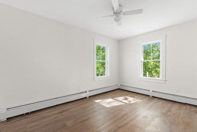 59 Altamont St, Haverhill, MA 01830 - empty room featuring wood finished floors, a baseboard heating unit, and ceiling fan