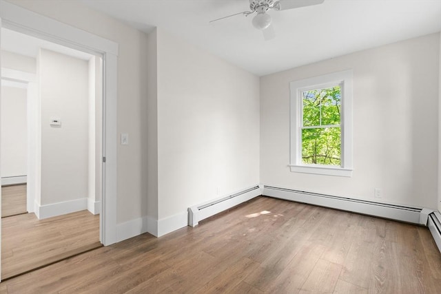 59 Altamont St, Haverhill, MA 01830 - unfurnished room with wood finished floors, ceiling fan, baseboard heating, and baseboards