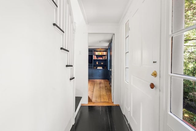 doorway to outside with dark wood-style floors