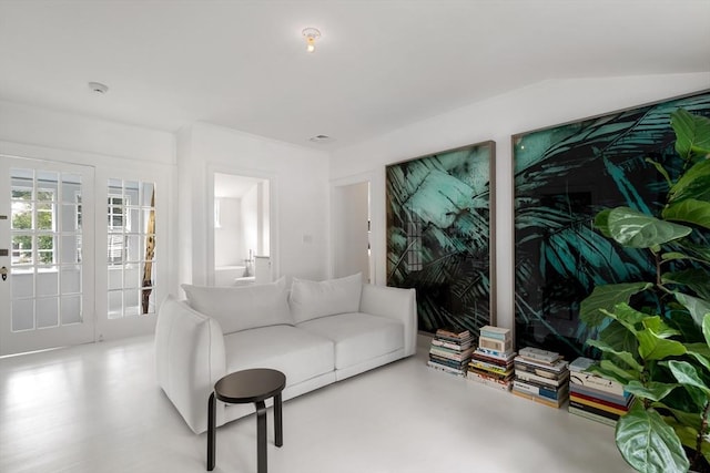 living area featuring finished concrete flooring