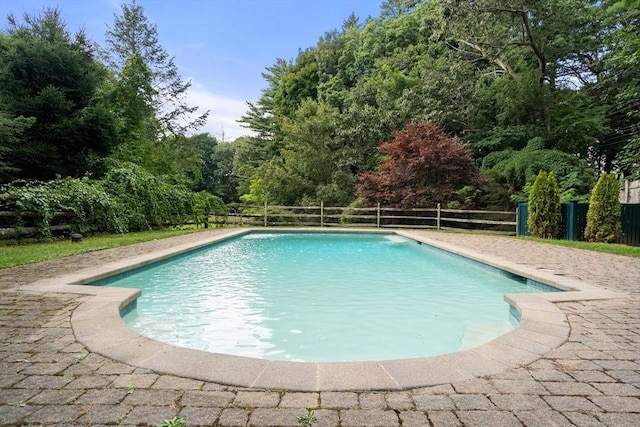 view of swimming pool featuring fence and a fenced in pool