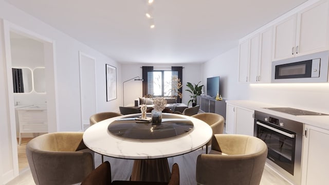 dining space with light wood-type flooring