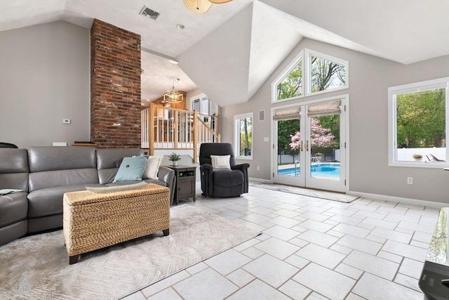 2 Cider Mill Rd, Peabody, MA 01960 - living area featuring stairs, baseboards, high vaulted ceiling, a chandelier, and french doors