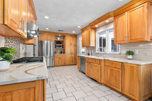 2 Cider Mill Rd, Peabody, MA 01960 - kitchen with stainless steel appliances, wall chimney exhaust hood, a sink, open shelves, and decorative backsplash