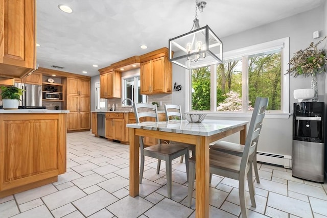2 Cider Mill Rd, Peabody, MA 01960 - kitchen featuring appliances with stainless steel finishes, recessed lighting, a chandelier, light countertops, and a baseboard radiator