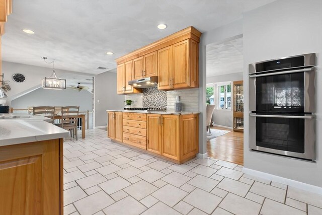 2 Cider Mill Rd, Peabody, MA 01960 - kitchen featuring double oven, under cabinet range hood, light countertops, recessed lighting, and tasteful backsplash