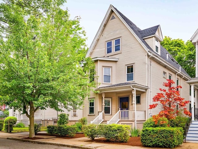 23 Hall Ave Unit 1, Somerville, MA 02144 - view of front facade with stairway and a shingled roof