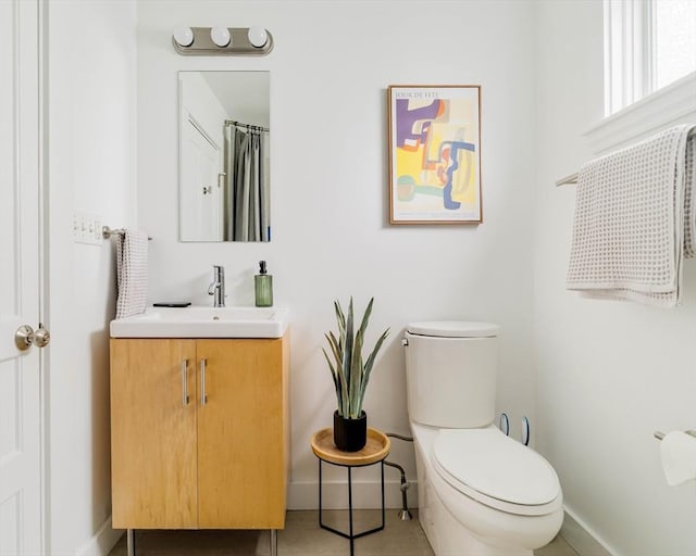 23 Hall Ave Unit 1, Somerville, MA 02144 - full bath featuring baseboards, vanity, toilet, and tile patterned flooring