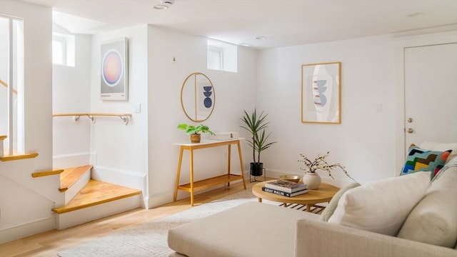 23 Hall Ave Unit 1, Somerville, MA 02144 - sitting room featuring wood finished floors, plenty of natural light, stairway, and baseboards