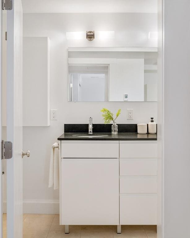 23 Hall Ave Unit 1, Somerville, MA 02144 - bathroom with vanity, baseboards, and tile patterned flooring
