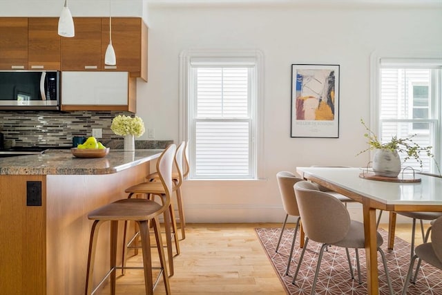 23 Hall Ave Unit 1, Somerville, MA 02144 - dining room with light wood finished floors and healthy amount of natural light