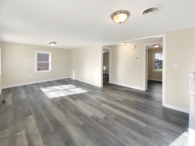 spare room featuring dark hardwood / wood-style flooring