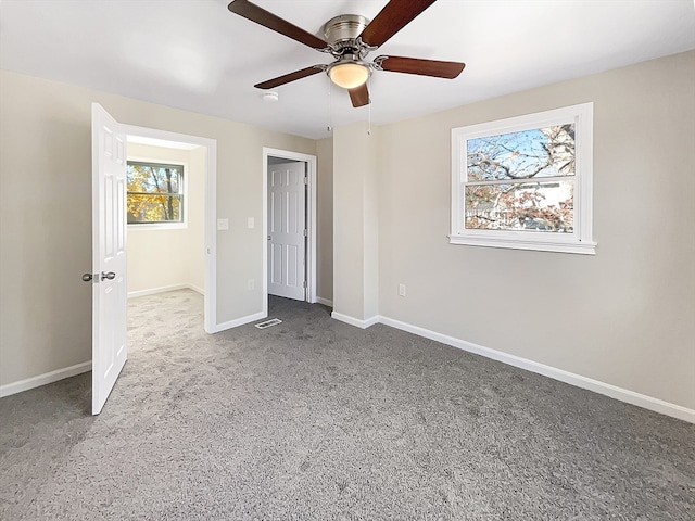 unfurnished bedroom featuring ceiling fan and carpet floors