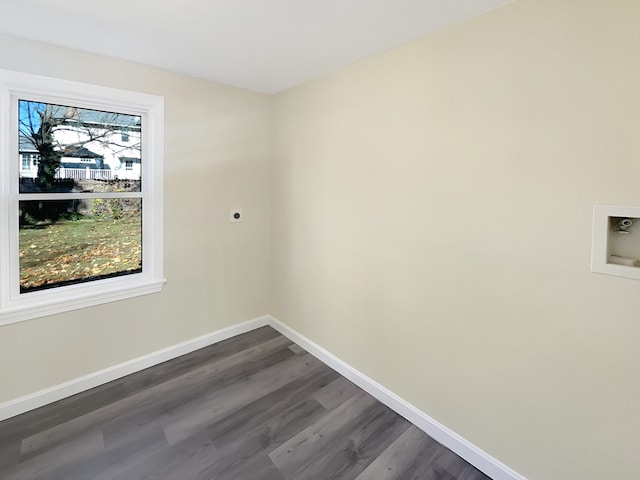 empty room with dark hardwood / wood-style flooring