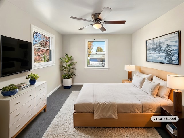 carpeted bedroom with ceiling fan