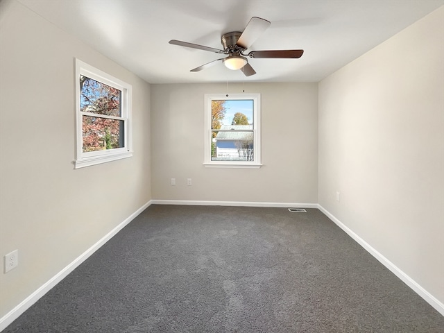 empty room with carpet flooring and ceiling fan