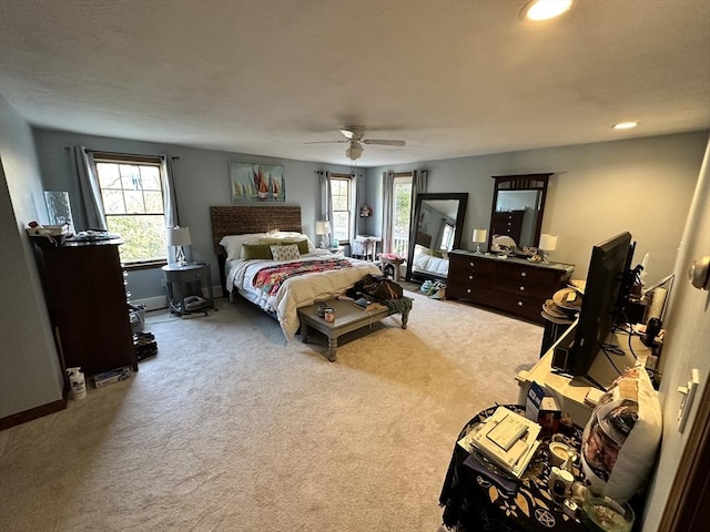 carpeted bedroom featuring multiple windows, recessed lighting, and ceiling fan