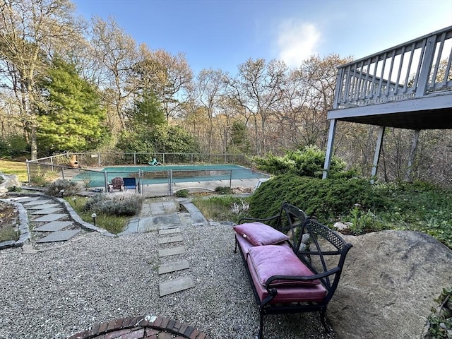 view of yard featuring a community pool and fence