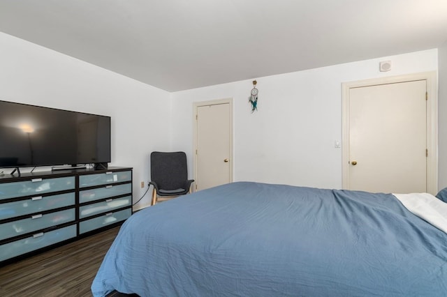 bedroom featuring dark hardwood / wood-style floors