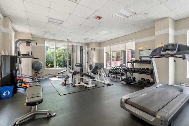 gym featuring a drop ceiling