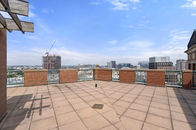 view of patio featuring a balcony