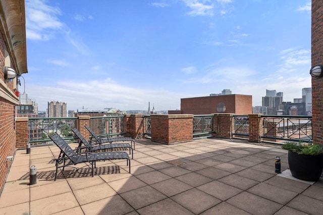 view of patio with a balcony