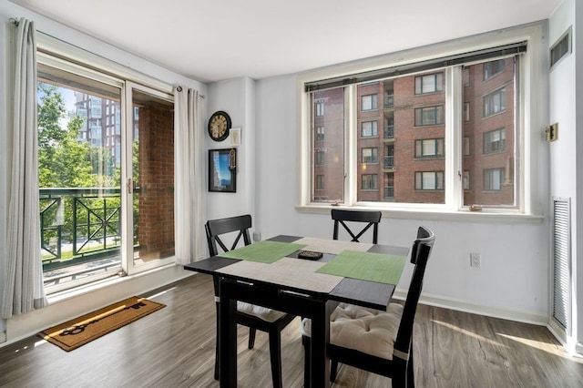 dining space featuring dark hardwood / wood-style flooring