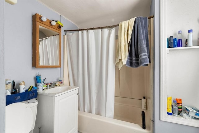 bathroom featuring shower / bath combo, vanity, and toilet