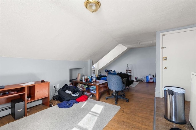 office area with lofted ceiling, a textured ceiling, and wood finished floors