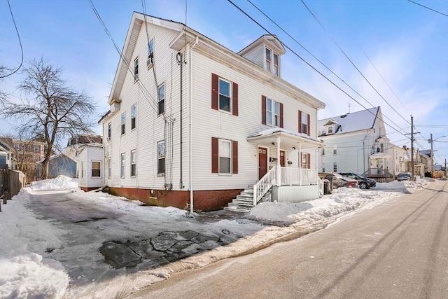 american foursquare style home featuring a residential view