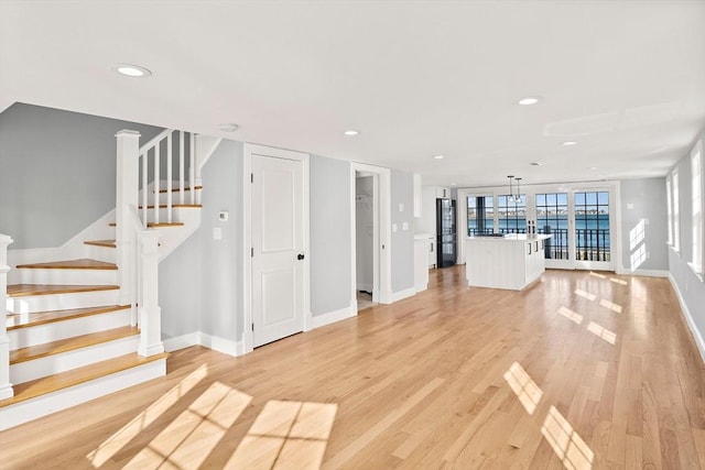 unfurnished living room with light wood-type flooring